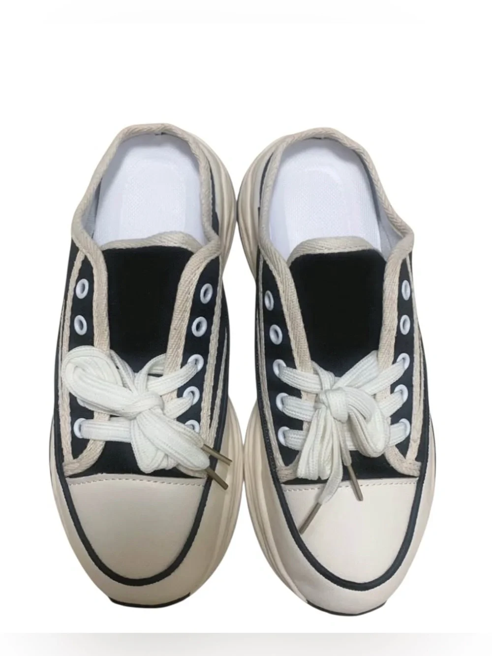 Women’s Black and Cream Slip-On Canvas Sneakers